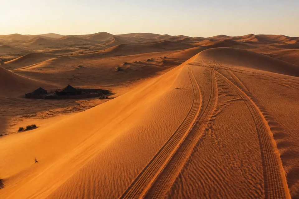 Orange dunes under a low sun