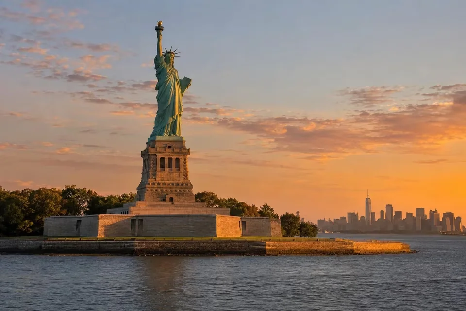 The Statue of Liberty with the Manhattan skyline behind it