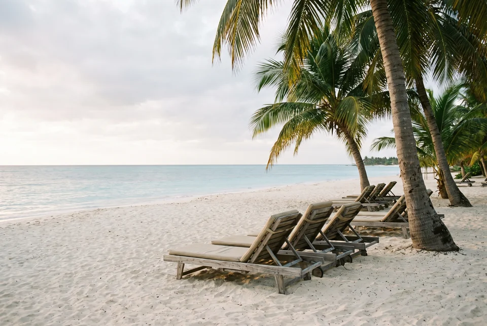 White sand, palms and empty loungers on Ancon Beach, visualization