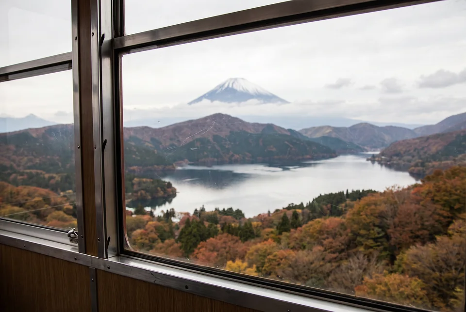 Snow-capped Mount Fuji, Lake Ashi and autumn forest seen from a Hakone ropeway cabin, visualization