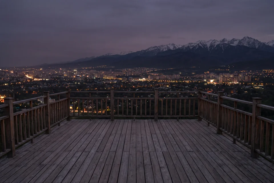 City lights of Almaty and the snow-capped Zailiysky Alatau from the wooden terrace on Kok Tobe, visualization
