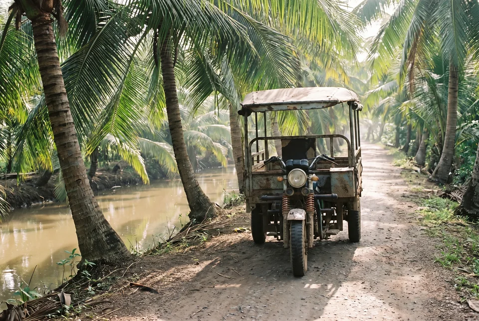 A xe lam three-wheeler on a palm-lined dirt road in the Mekong Delta, visualization