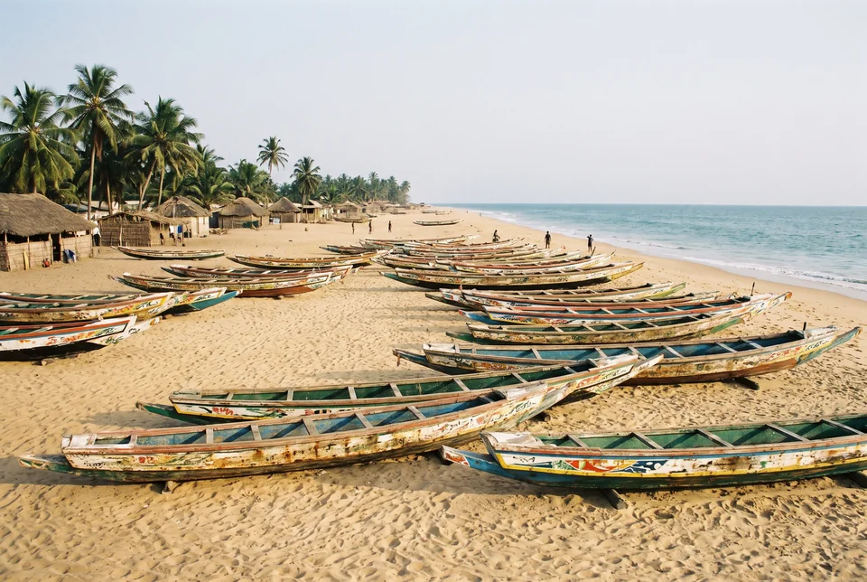 Colourful wooden fishing boats pulled onto the beach of Ngor Island, visualization