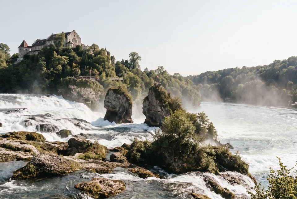 Rushing water, rock islets and the castle on the bank at Rhine Falls, visualization