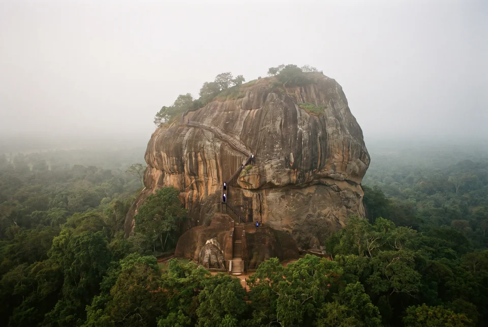 Sigiriya Rock Fortress rising above the misty forest, visualization