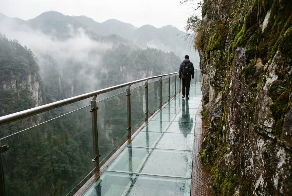 Glass skywalk along a misty cliffside on Tianmen Mountain, visualization