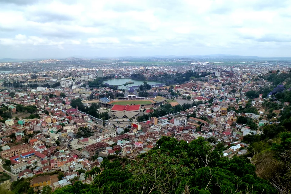The red-roofed city, Lake Anosy and the stadium seen from a hill in Antananarivo