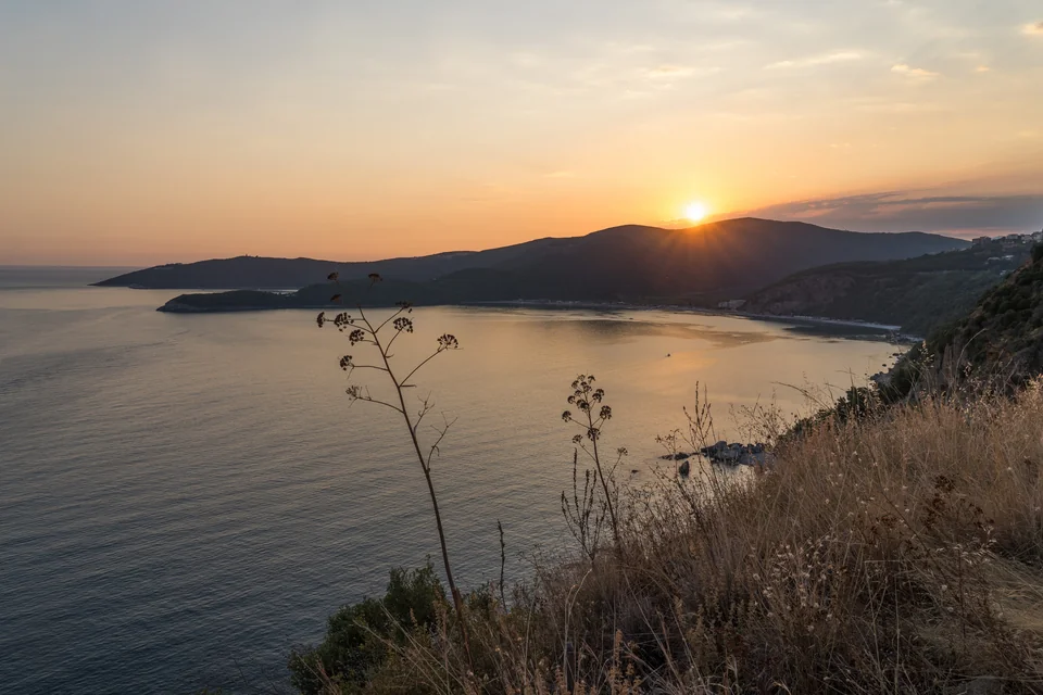The bay and mountain ridges at sunset in Budva