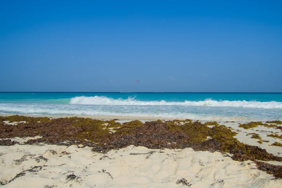 A white sand beach and turquoise Caribbean surf in Cancún