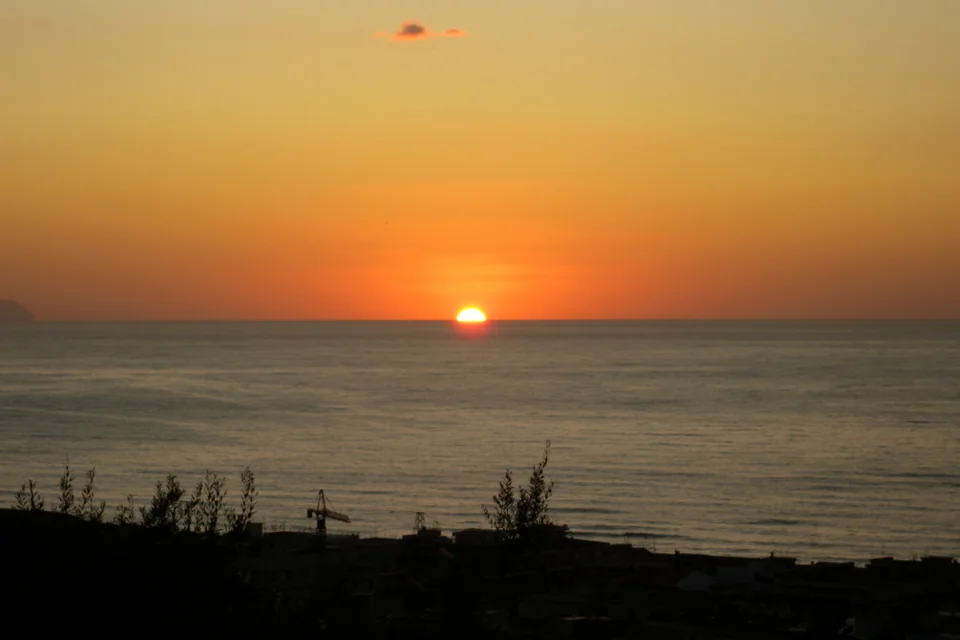 The sun setting over the Tyrrhenian Sea at Cefalù