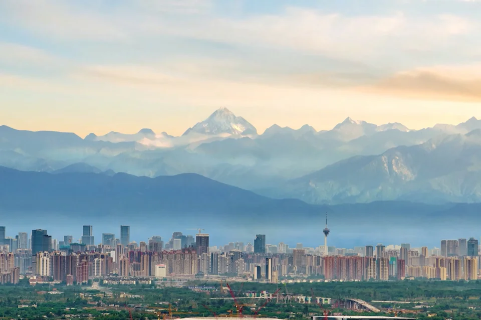 The Chengdu skyline with snow-capped Sichuan mountains behind