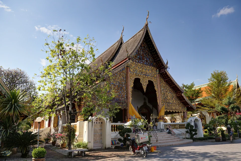 A Buddhist temple with a carved Lanna-style roof in Chiang Mai