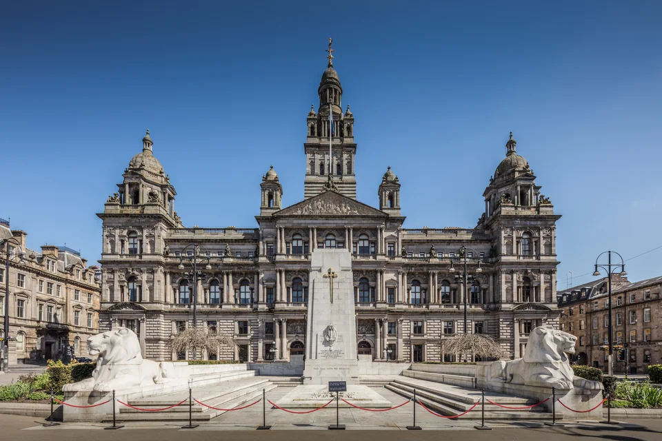 The towered Victorian City Chambers and the memorial on George Square, Glasgow