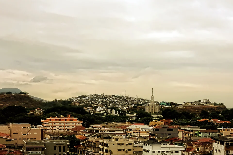 Guayaquil rooftops with the colourful houses of Santa Ana Hill behind