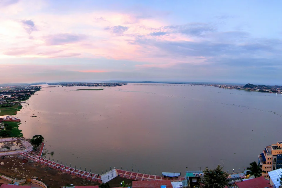 The Guayas River at sunset with the city stretching along its bank in Guayaquil