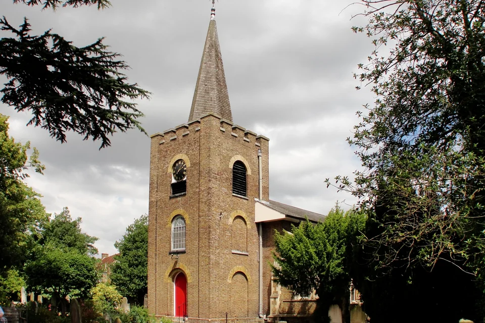 The historic brick-towered St Dunstan's Church in Feltham near Heathrow