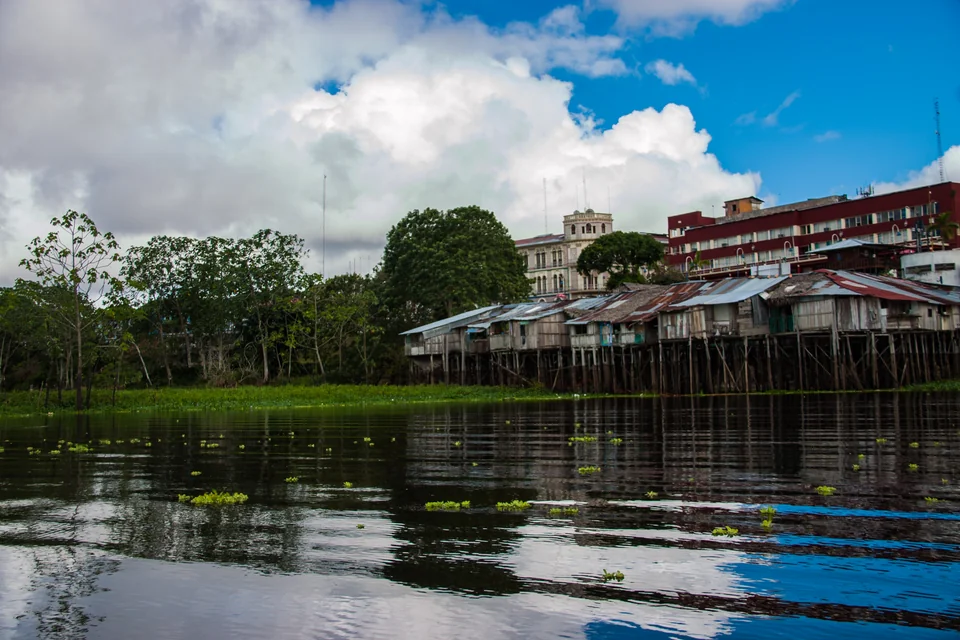 Houses on stilts along the riverbank in Iquitos