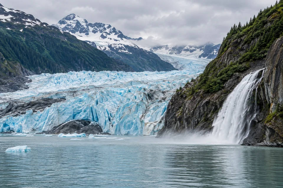 Mendenhall Glacier near Juneau with Nugget Falls pouring into the glacial lake