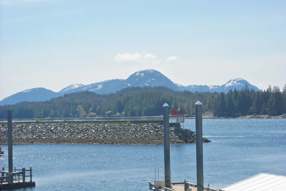 Ketchikan harbour, forested islands and snowy mountains behind