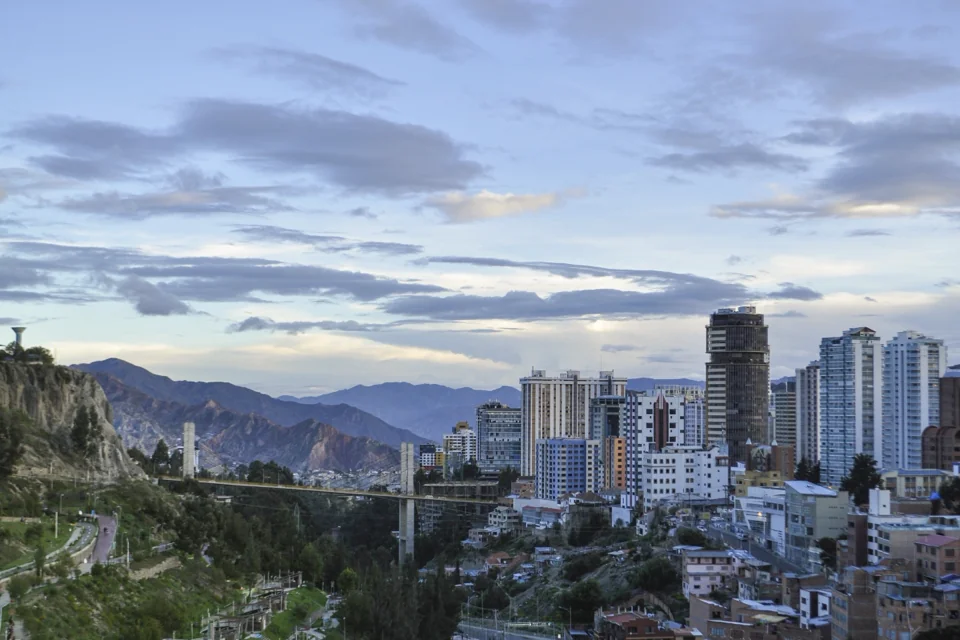 Central La Paz and its towers spread across a valley with mountains behind