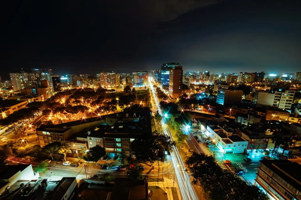 Lima glowing with city lights and avenues at night