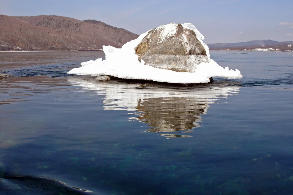 The snow-capped Shaman Rock at the mouth of the Angara near Listvyanka