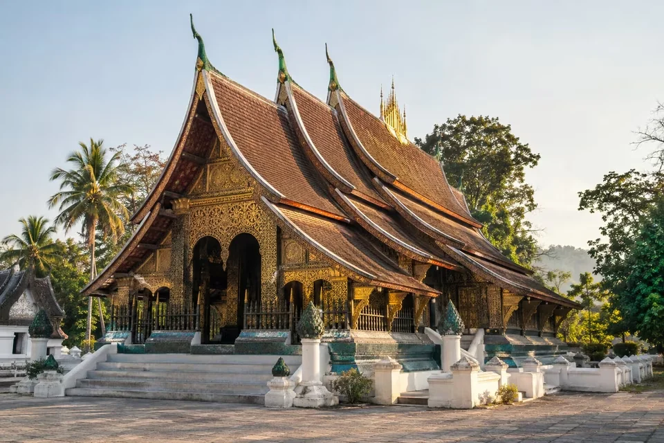 The low sweeping roof of Wat Xieng Thong in Luang Prabang