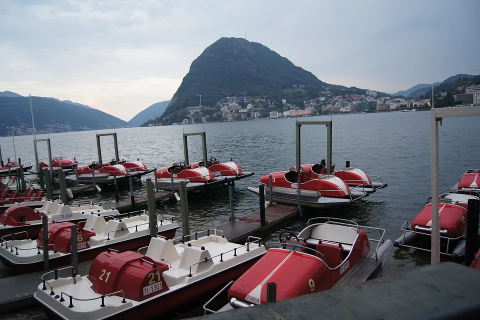 Pedal boats on the lakeshore with Monte San Salvatore behind, Lugano