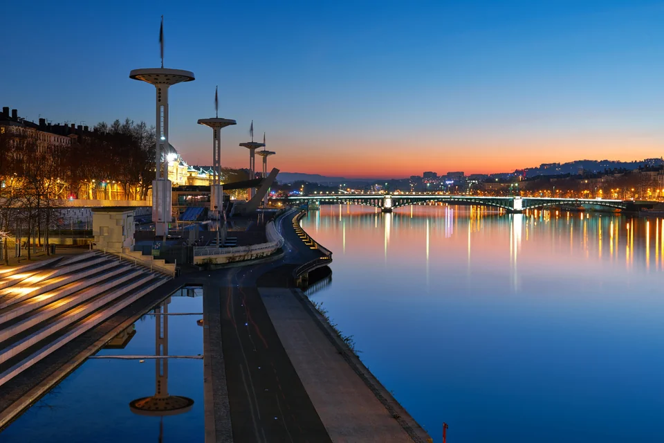 The Rhône riverbank and bridges at dusk in Lyon