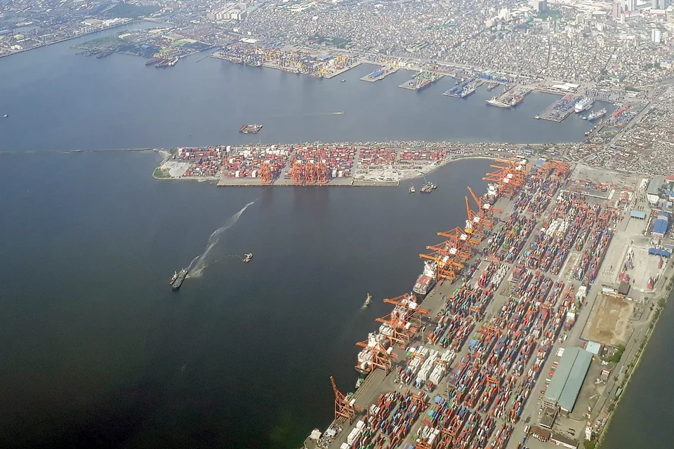 An aerial view of the Port of Manila and the city spreading along the bay