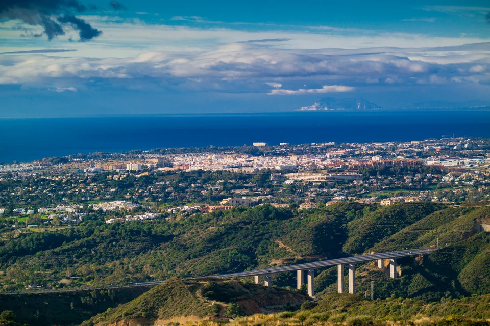 The coastal town of Marbella, the Mediterranean and African peaks on the horizon, seen from above