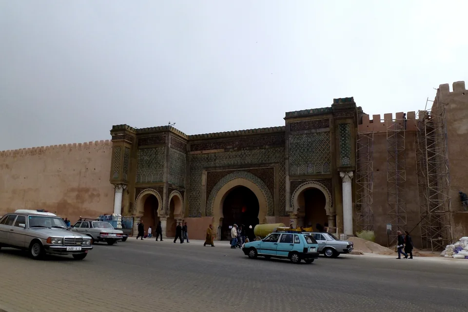 The monumental tile-decorated Bab Mansour gate and walls in Meknes