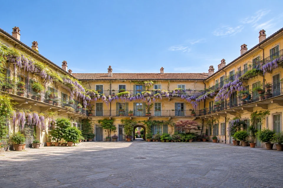An arcaded inner courtyard with wisteria in Milan