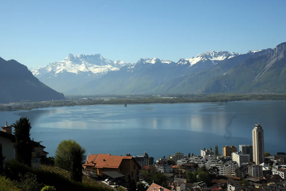 Lake Geneva, the town and the snowy Alpine peaks across the water at Montreux