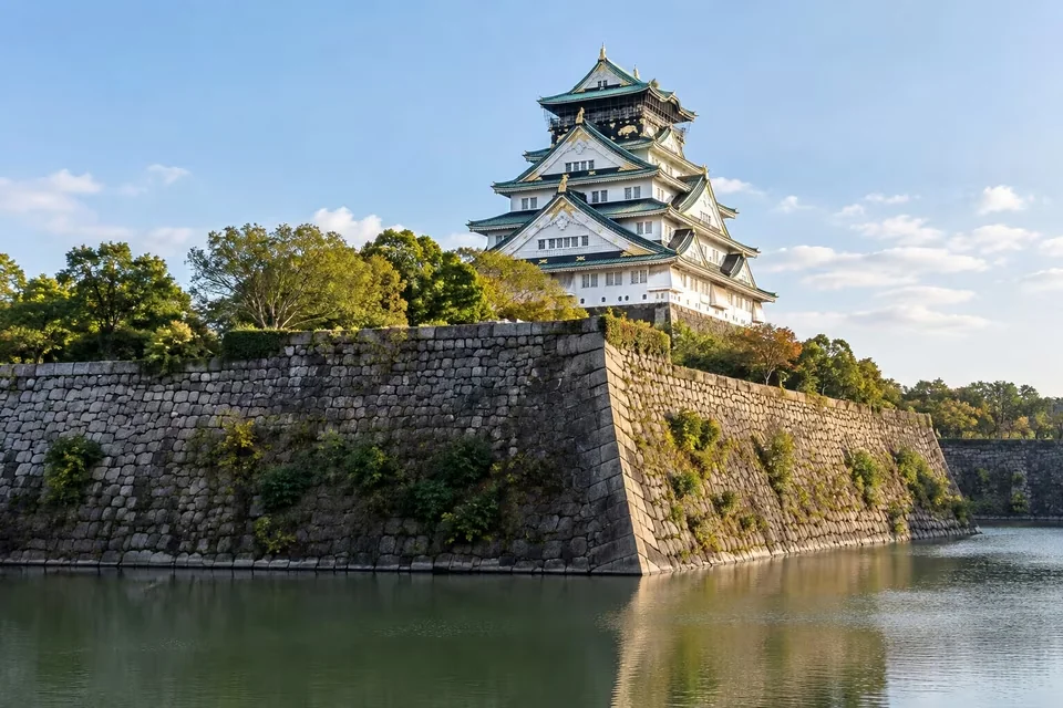 The green-roofed keep and stone walls of Osaka Castle