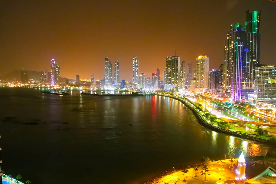 The bayfront and skyscrapers lit up at night in Panama City
