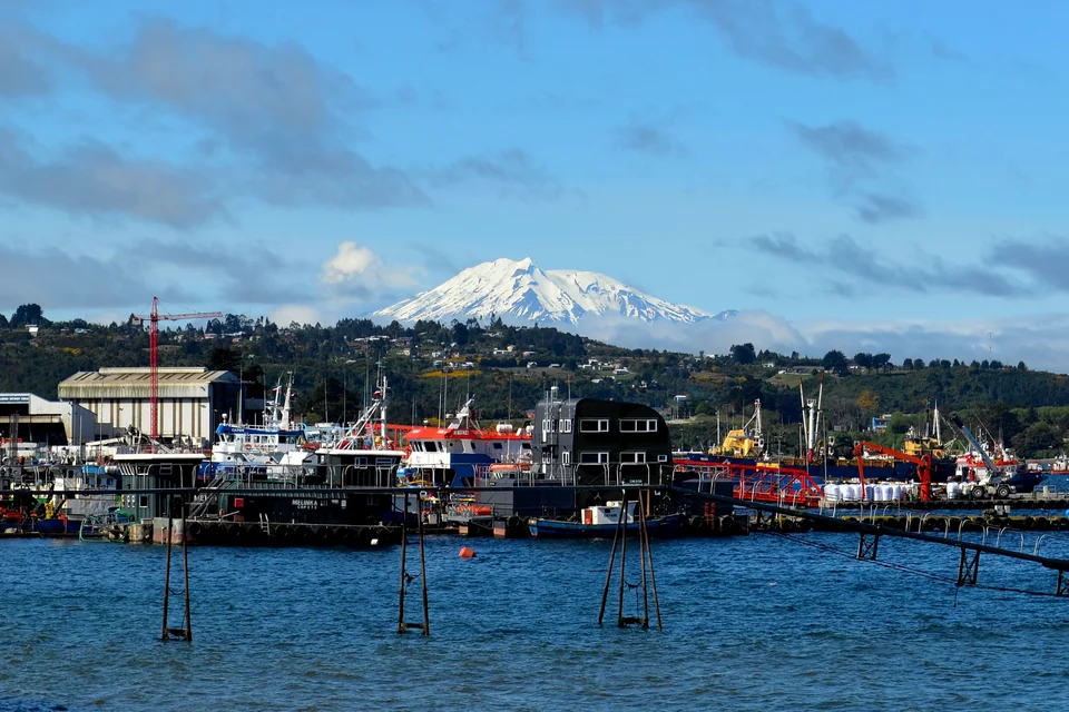 Boats in Puerto Montt harbour with the snow-capped Calbuco volcano behind
