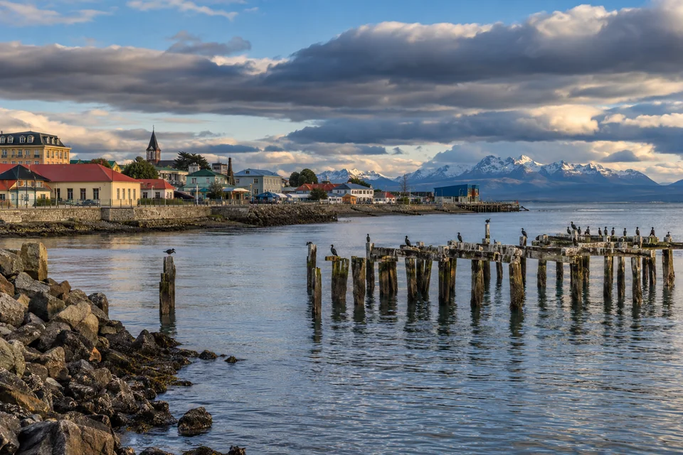 Punta Arenas' colorful rooftops and old wooden pier on the Strait of Magellan