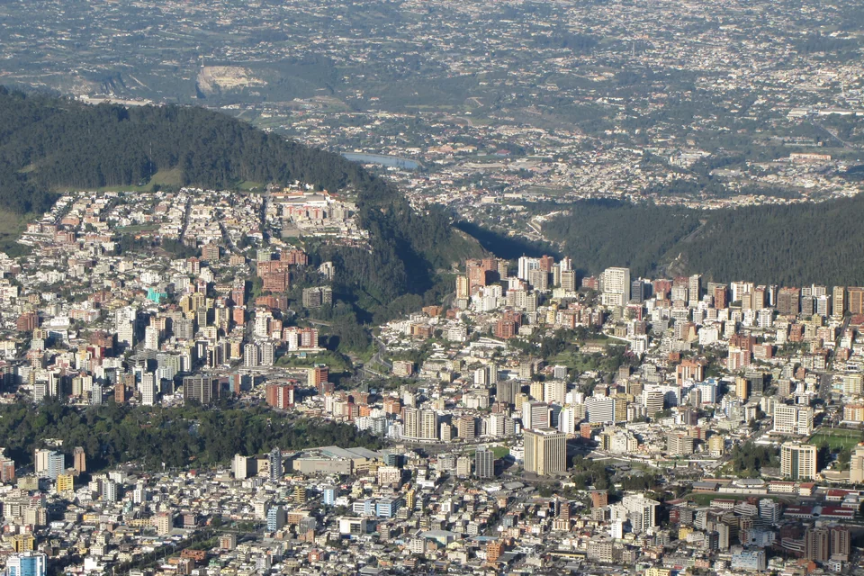 Forested hills and the city below seen from the TelefériQo cable car, Quito
