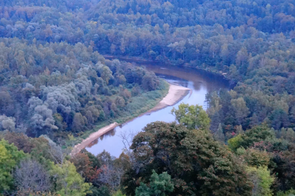 The Gauja River winding through forest at Sigulda, seen from above