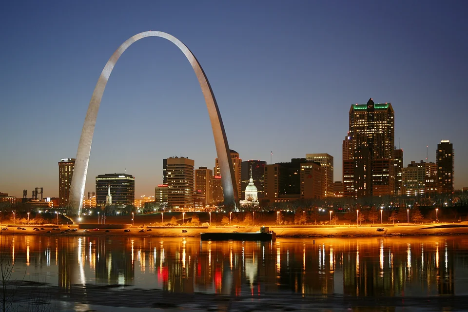 The Gateway Arch and city lights reflected in the river at night, St. Louis