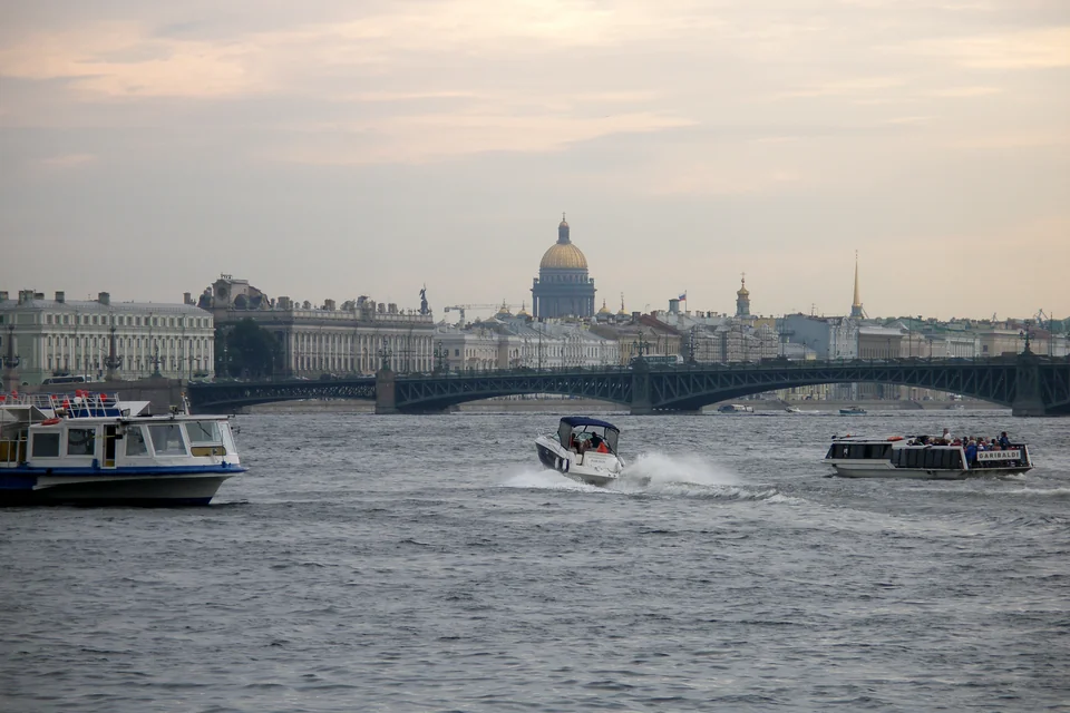 The Neva River, a bridge, boats and the golden dome of St Isaac's Cathedral, Saint Petersburg