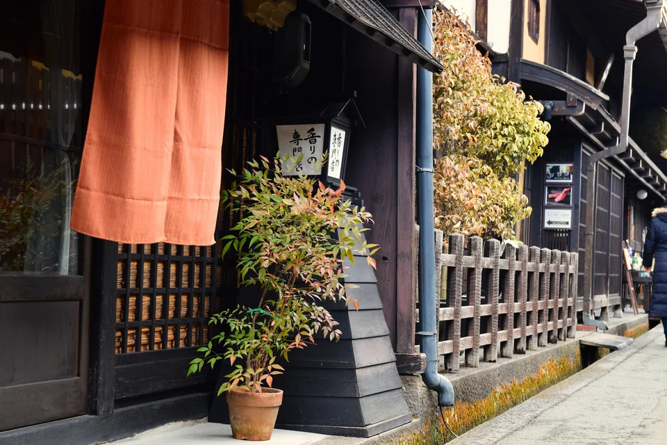 Dark timber-fronted traditional merchant houses in Takayama's old town