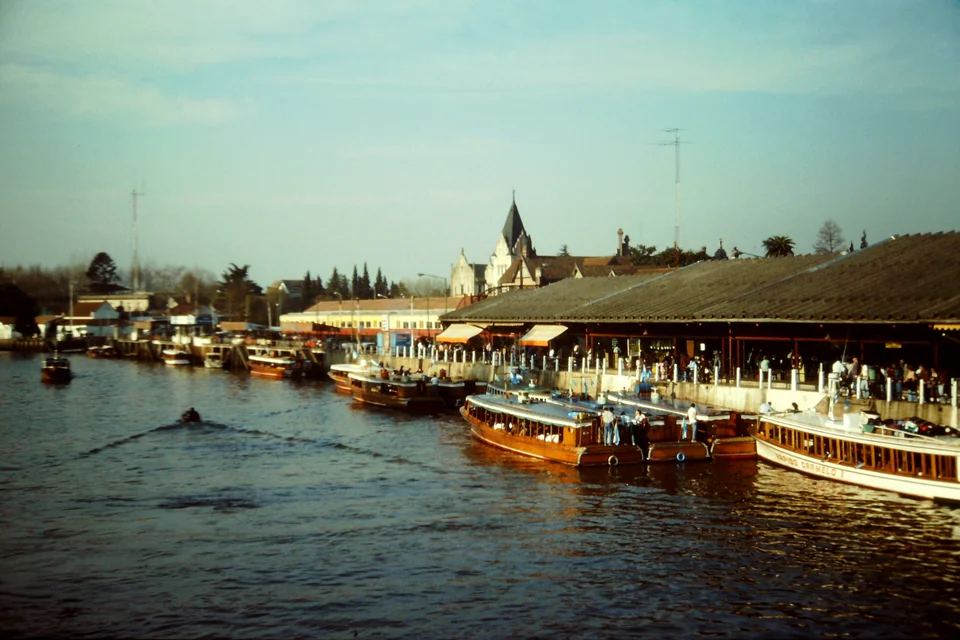 Wooden passenger launches lined up at the river station in Tigre