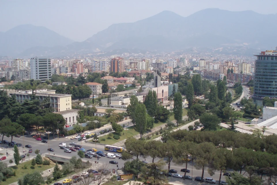 Tirana from above with tree-lined boulevards and Mount Dajti behind
