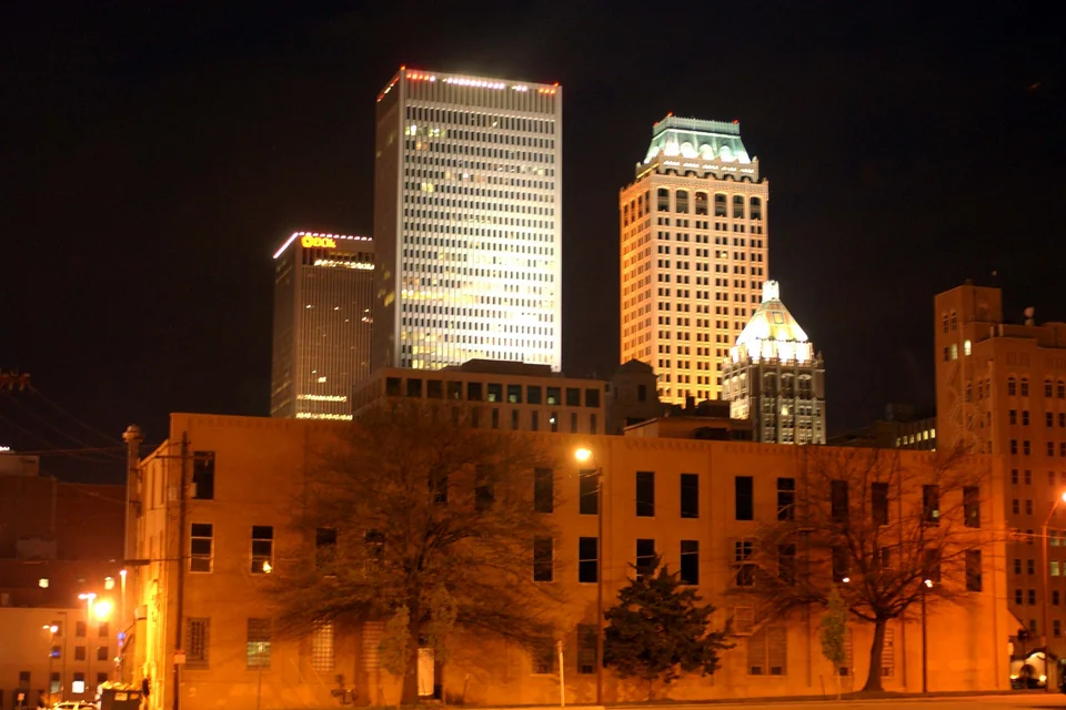 Art deco skyscrapers lit up at night in Tulsa