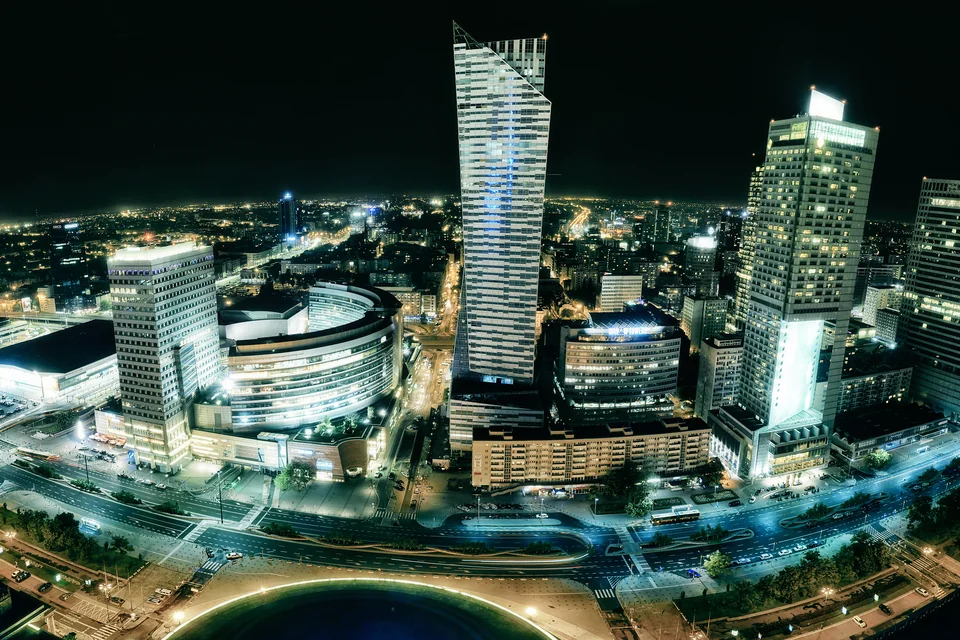 Skyscrapers and the city centre lit up at night in Warsaw