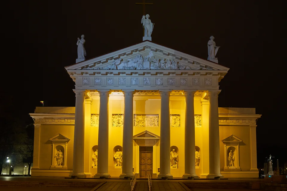 The colonnaded Vilnius Cathedral lit up at night