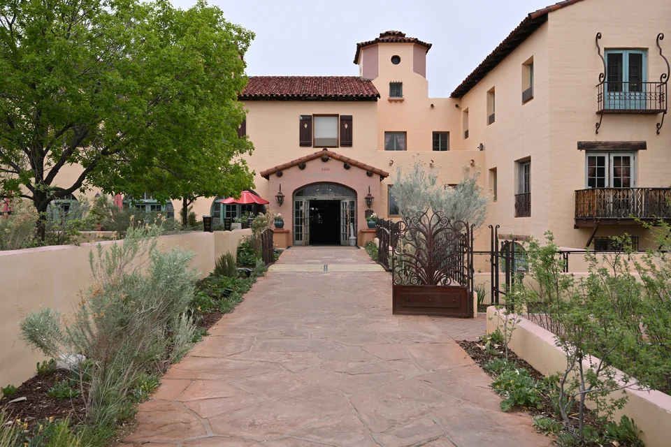 The historic adobe-style La Posada building and its garden path in Winslow
