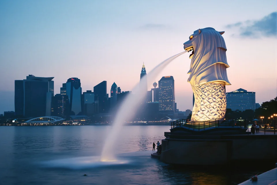 The Merlion statue spouting water into Marina Bay in Singapore